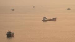 Container ship hit by projectile sinks in Strait of Hormuz, Singapore